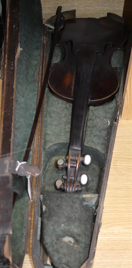 A mid 19th century German violin, bears Nicolas label, cased with a silver mounted bow, back 36cm